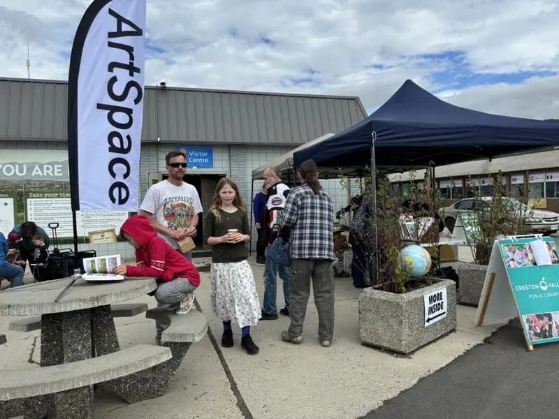 Community members at the ArtSpace Earth Day booth
