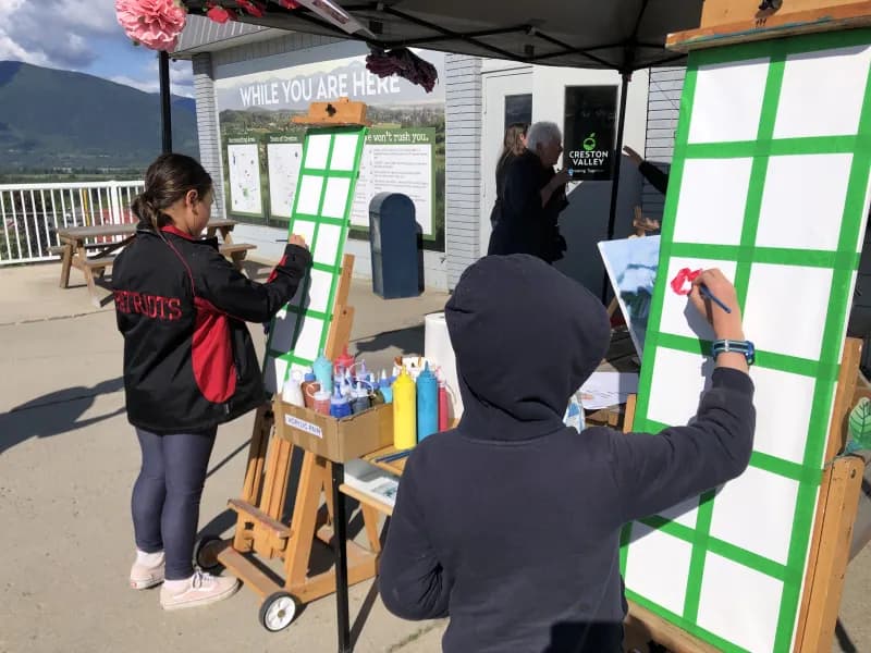 Community members painting at the ArtSpace booth during the Blossom Valley Festival