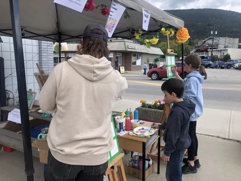 Kids painting at the ArtSpace booth at the Farmers Market